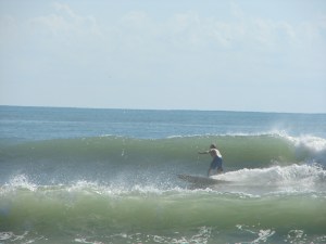 Image 2 of 5, MIke on a shoulder high right at 4rth street, Tropical Storm Maria, Thursday September 15, 2011