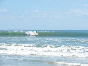 Image 1 of 6 shot sequence. The Florida Gator Girl rips a shoulder high backside left.  I don't know her, but she tore it up out there.  Hurricane Ophelia delivered some beautiful waves for the Cape and Johnson Avenue,  Sunday October 2 2011.  photos by oldwaverider :)