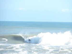 Giving it one last effort to climb ahead back up onto the face.  I believe Kelly Slater or CJ or Damien Hobgood, might have worked their way back up top, but this guy did a stellar job of setting up and getting into the barrel and out of the sunlight :)  Image 6 of 6 shot sequence  DSC04536