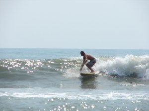Chad, enjoying a classic glassy waist to chest high surf day.  Photo by Sunny