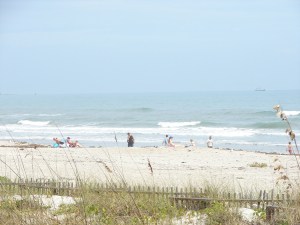 A nice day, some Sun, a little haze,  some fun waves, people just enjoying the beach :)