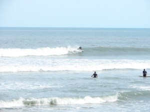 Pulls out of a slight barrell and another attempt to drop low and pull out in front. Image 6 of 7 sequence.
